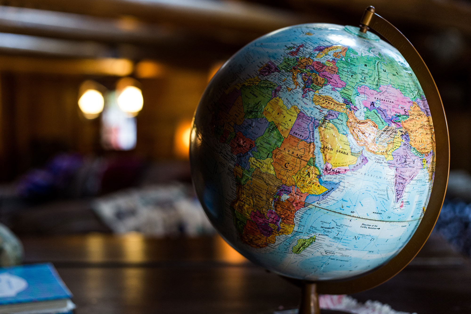 full color globe sitting on a desk in an office